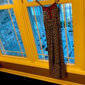 Justice long dress with adjustable straps and has a back tie